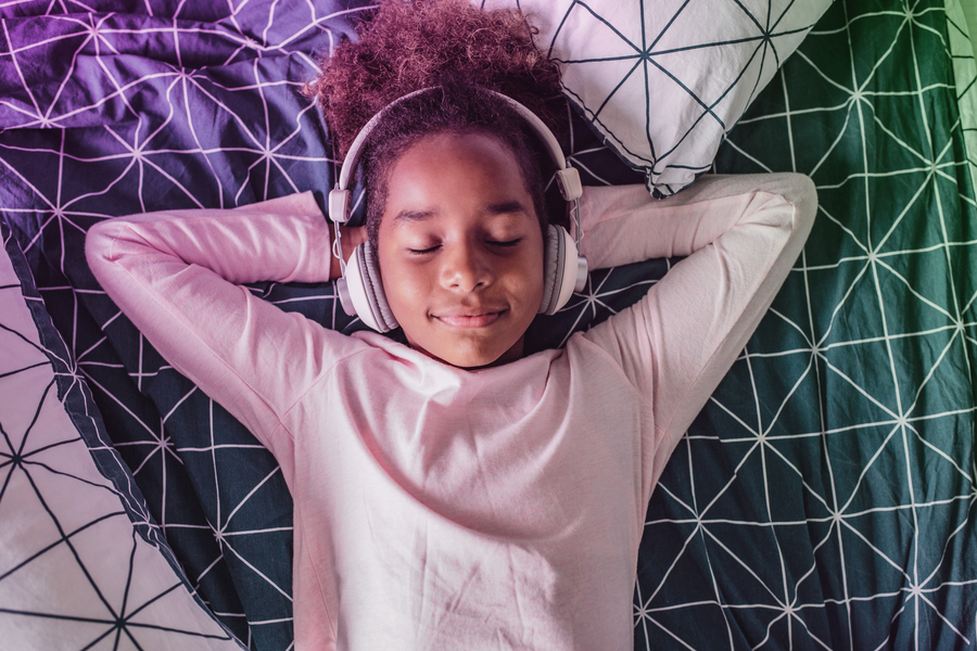 Student relaxing with music