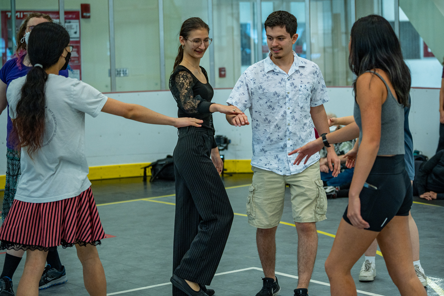 Students form a dance circle.